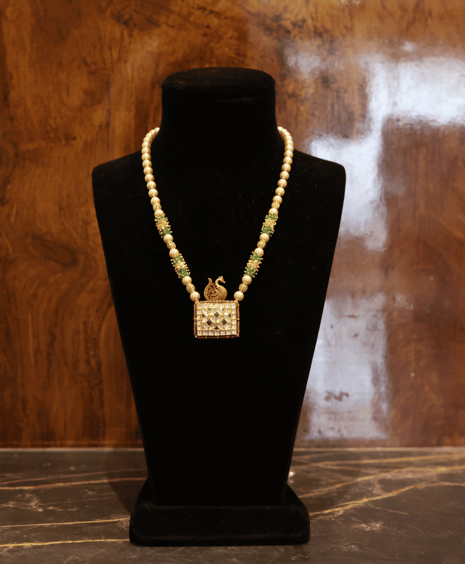 Elegant Pearl Mala with Kundan Peacock Pendant & Emerald Beads